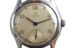 Omega reference CK2450 with white and grey two tone dial, alternating arabic numerals and markers, outer railroad minute track and subsecond with printed second track.